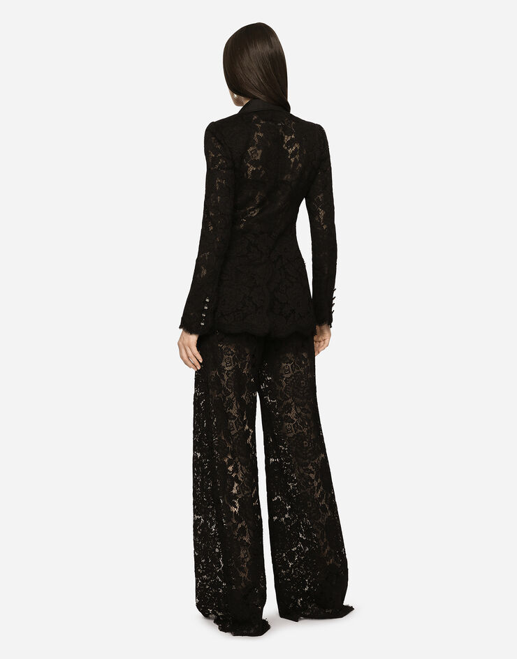 Dolce & Gabbana Pantalon flare en dentelle stretch à logo Noir FTCPTTFLRE1