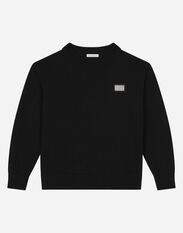 Dolce & Gabbana Round-neck plain knit sweater with logo tag Negro L4KWE1JCVR9