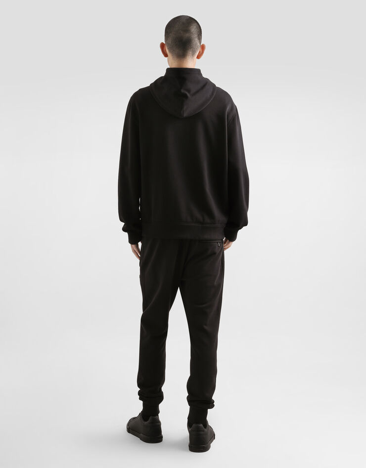 Dolce & Gabbana Jersey trousers with heraldic patch Black GP07TZG7PJ7