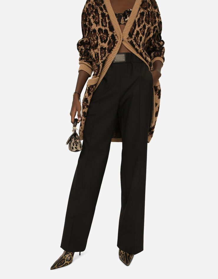 Dolce&Gabbana Pantalon flare en laine avec plaquette à logo Noir FTCZJTGDBWS