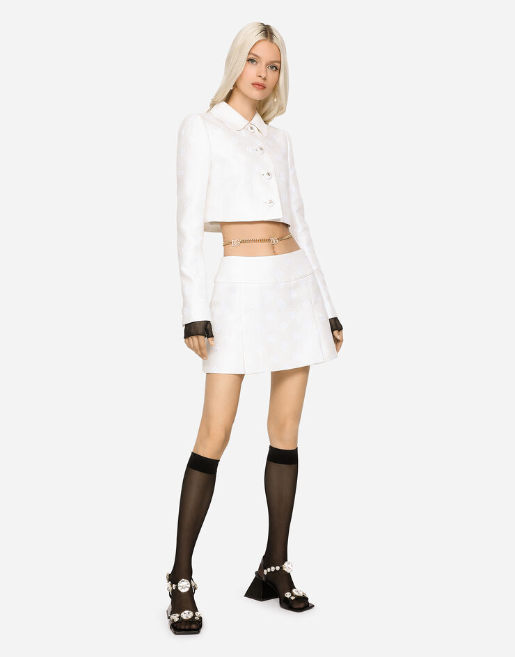 Dolce & Gabbana Mini-jupe en jacquard à logo DG all-over Blanc F4CEATFJTBP