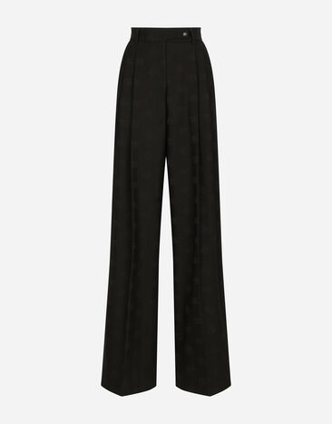 Dolce & Gabbana Расклешенные брюки из шерсти с жаккардовым узором DG принт FTC3HTHS5Q0