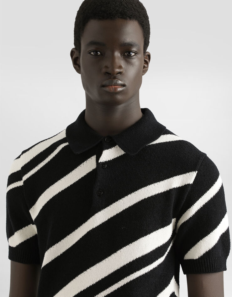 Dolce & Gabbana Jersey polo de algodón de manga corta con intarsia a rayas Multicolor GXZ64TJFMMS