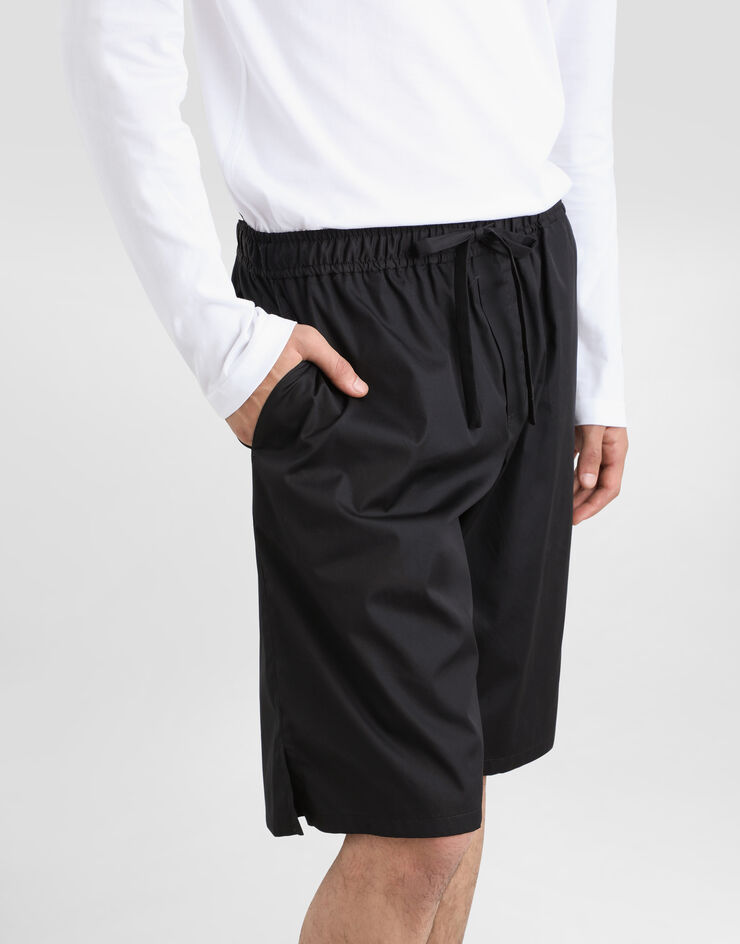 Dolce & Gabbana شورت للركض قطني ببطاقة شعار أسود GV37ATGF855