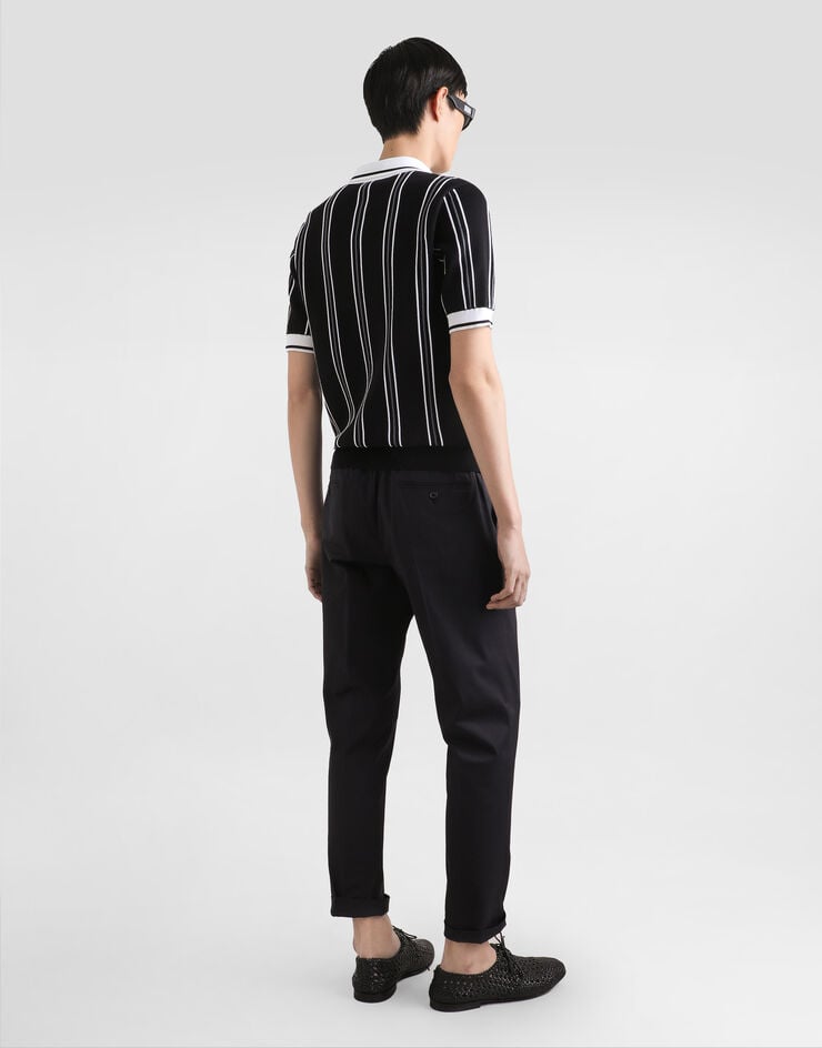 Dolce & Gabbana Poloshirt aus Baumwollstrick mit Intarsie Mehrfarbig GXZ92ZJBCHD