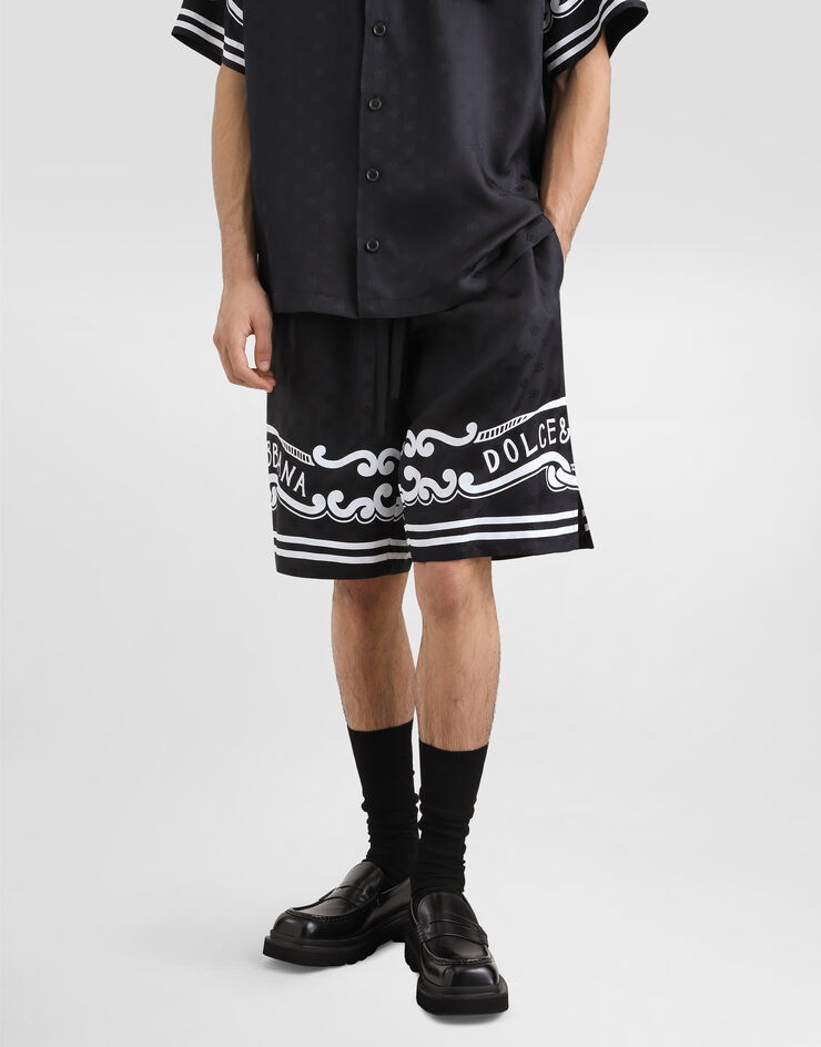 Dolce & Gabbana شورت حرير بتفاصيل طبعة ربطة رأس أسود GV37ATGI979