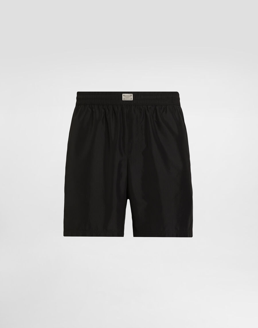 Mid-length swim trunks with tag