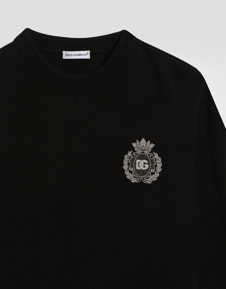 Dolce & Gabbana Plain knit pullover with patch Black L4KW22JCVXQ