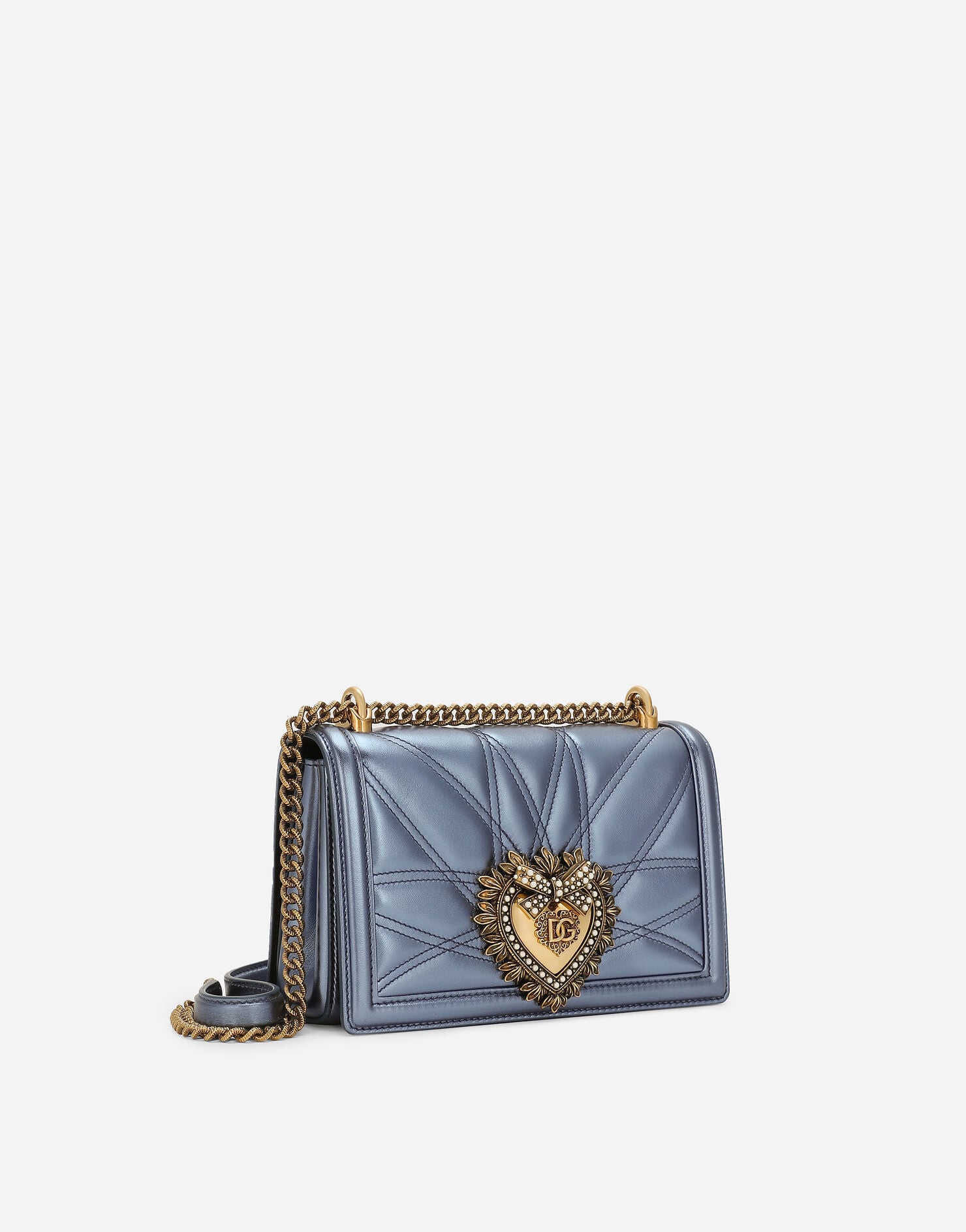 Close-up of the blue Dolce & Gabbana Devotion Bag and Sacred Heart clasp.