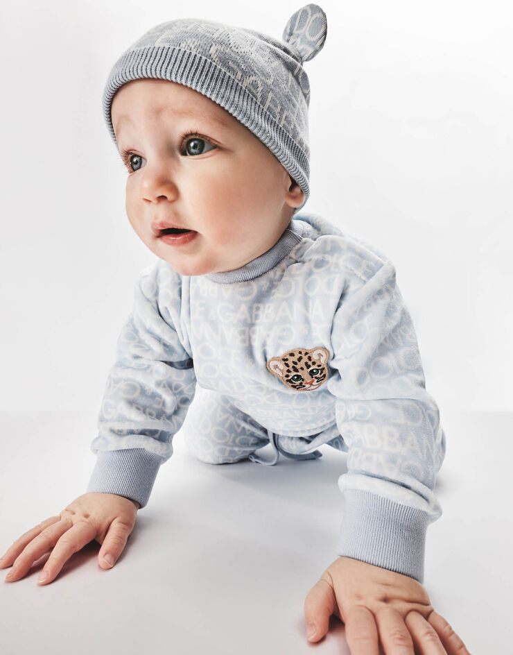 DolceGabbanaSpa Long-sleeved jersey onesie with all-over logo print and patch Azure L1JO6MG7KS3
