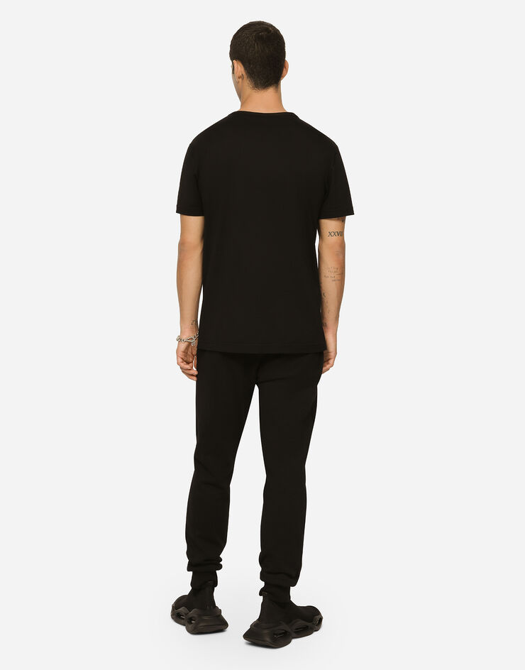 Dolce&Gabbana Pantalón de chándal en punto con placa con logotipo Negro GVXQHTG7F2G