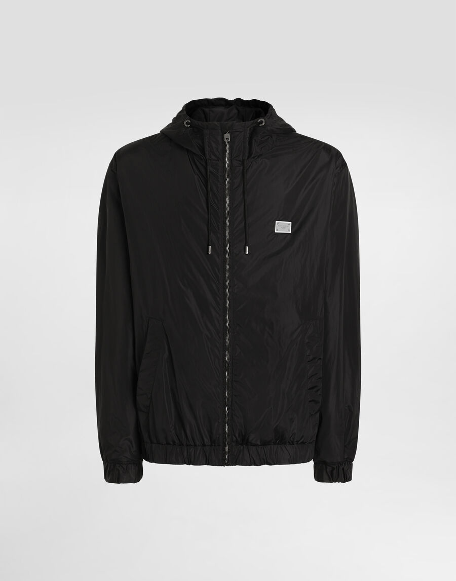 Technical fabric jacket with hood and tag