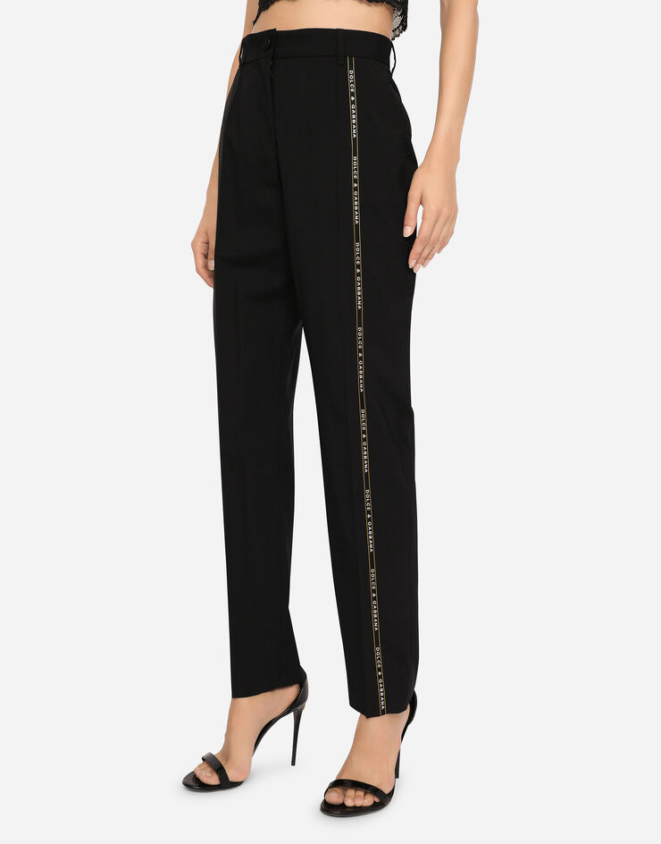 Dolce & Gabbana Pantalon en toile de laine avec liseré à logo Noir FTAM2TFUBEF