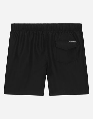Dolce & Gabbana Nylon swim trunks with logo print Black L4J818G7KM9