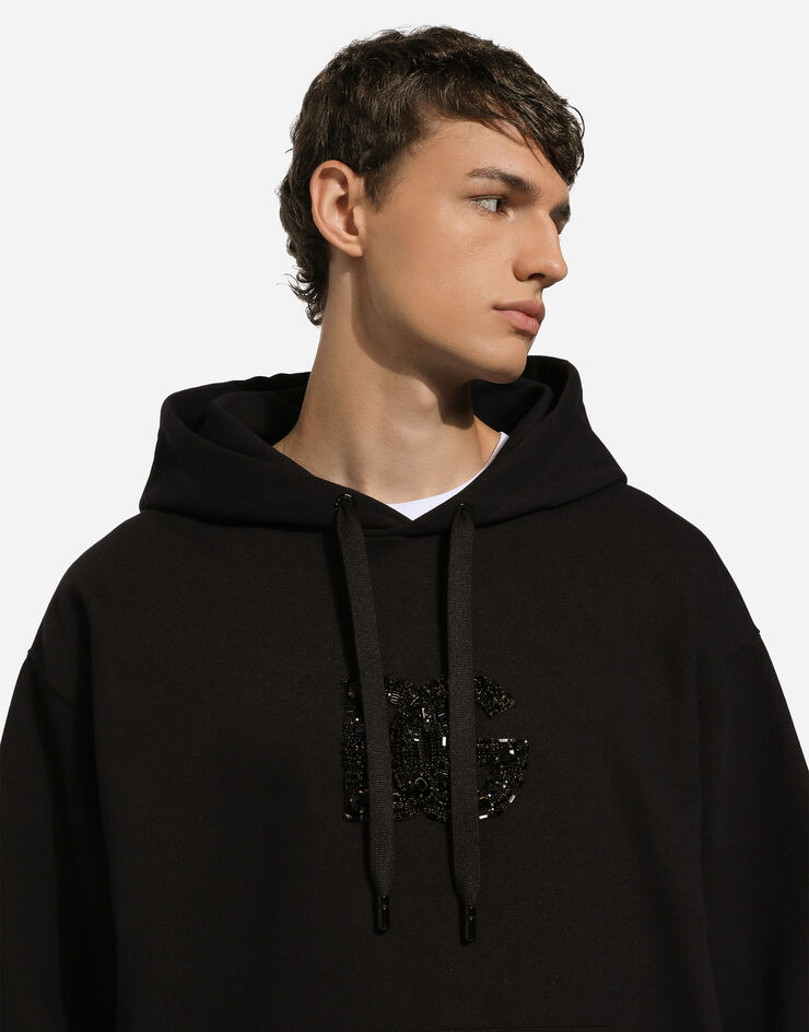 Dolce & Gabbana Sweat-shirt à capuche et écusson DG en strass Noir G9ZU0ZG7K4P