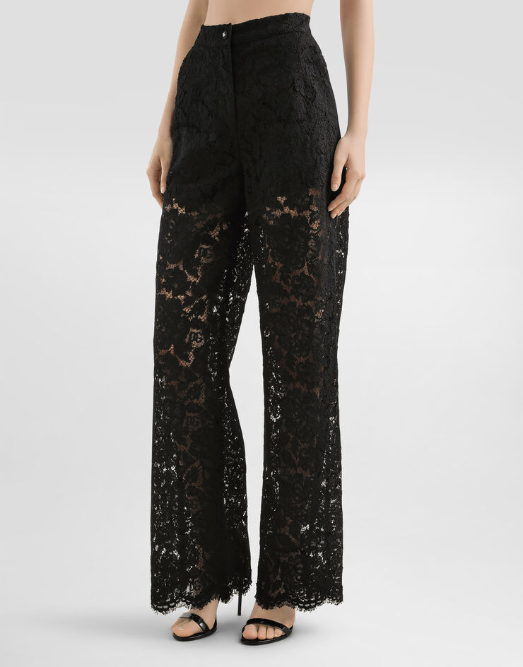 Dolce & Gabbana Ausgestellte Hose aus elastischer Spitze mit Logo Schwarz FTCPTTFLRE1