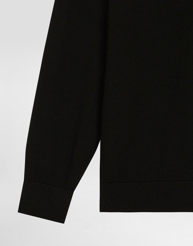 Dolce & Gabbana Plain knit pullover with patch Black L4KW22JCVXQ
