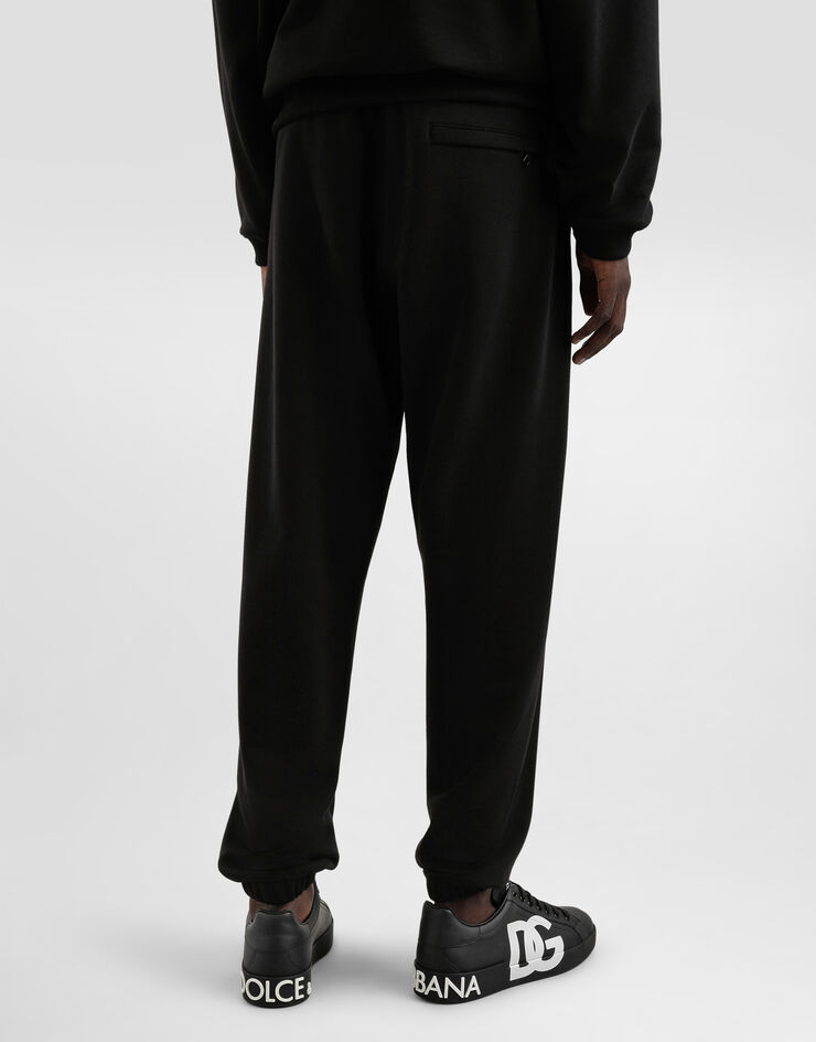 Dolce & Gabbana Jogginghose aus Stretchjersey mit Stickerei Schwarz GP0G4ZG7O2S