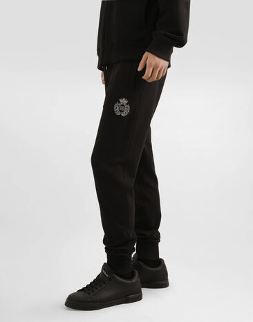 Dolce & Gabbana Jersey trousers with heraldic patch Black GP07TZG7PJ7