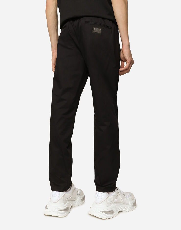 Dolce & Gabbana Jogginghose Baumwollstretch mit Plakette Blau GVZAETFUFJR