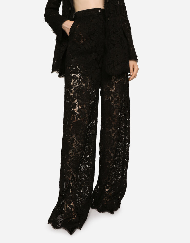 Dolce & Gabbana Pantalon flare en dentelle stretch à logo Noir FTCPTTFLRE1