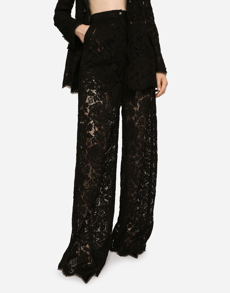 Dolce & Gabbana سروال من دانتيل مرن موسوم جرسي أسود FTCPTTFLRE1