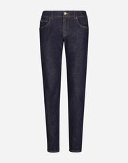 Dolce&Gabbana Skinny stretch denim jeans with flocked logo tag Multicolor G038TTFJPAF