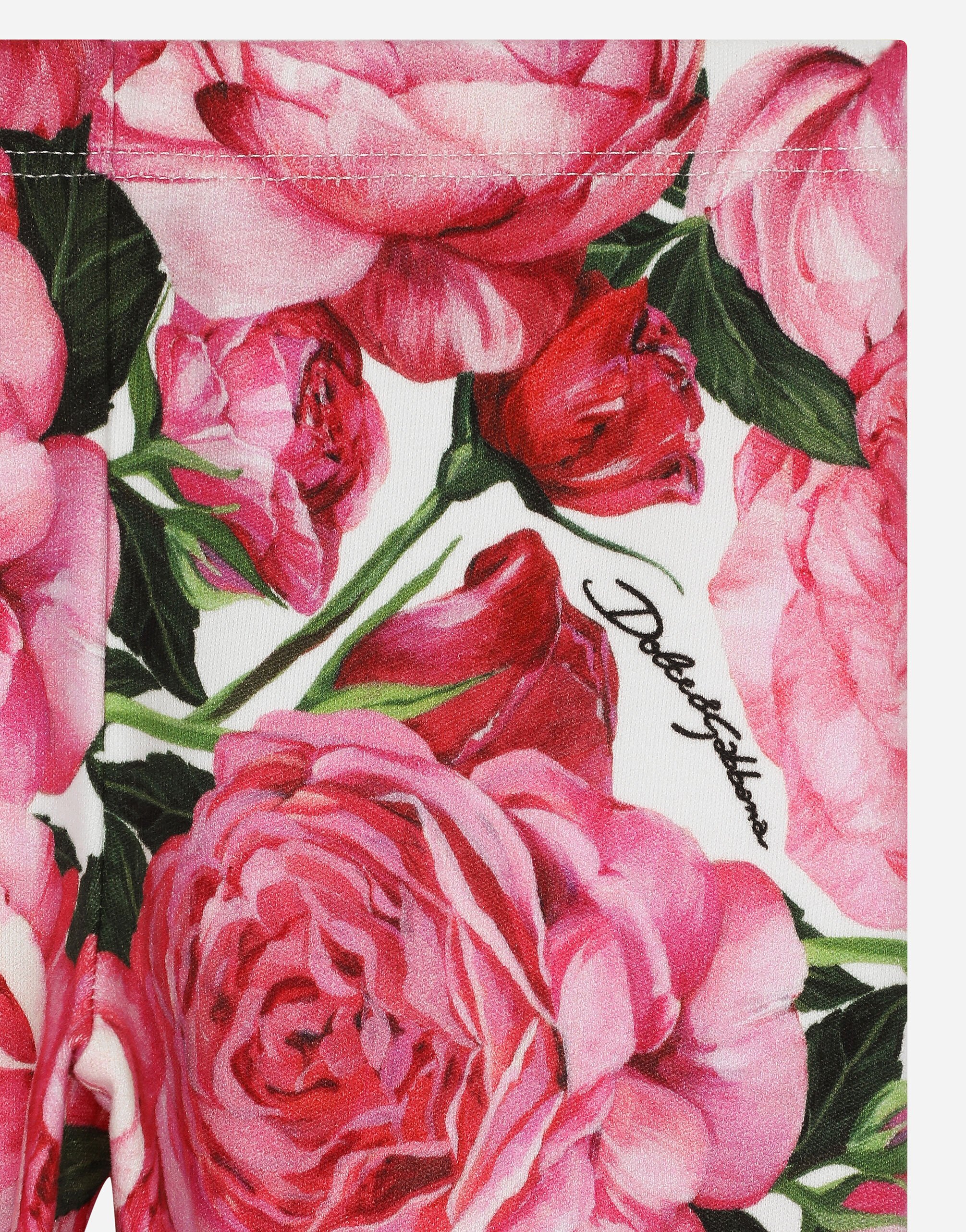 Interlock leggings with rose print over a white background in Print for Girls Dolce Gabbana