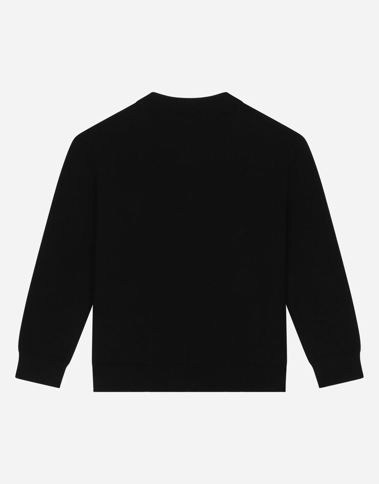 Dolce & Gabbana Round-neck knit pullover with logo tag Black L4KW22JCVD7