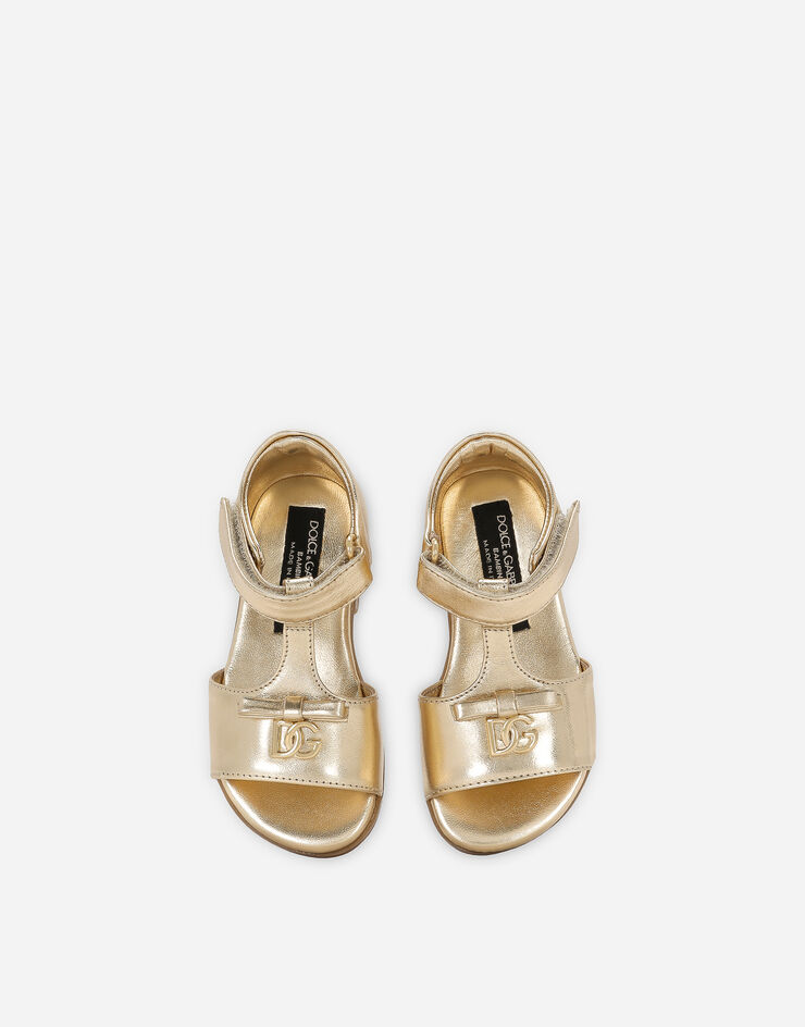 Foiled leather First Steps sandals in Gold for