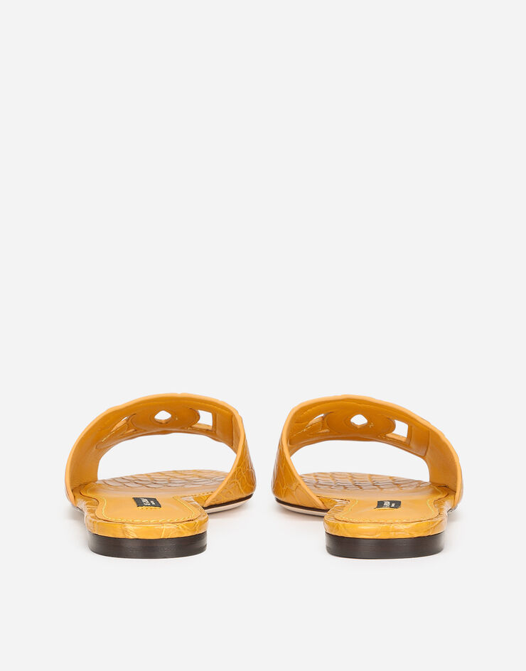 Dolce & Gabbana “Fianchi cocco” crocodile skin slides with the DG Millenials logo Orange CQ0436A2W90