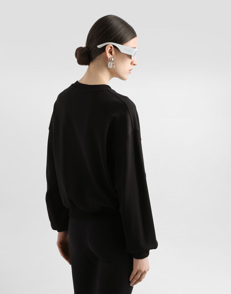 Dolce & Gabbana Sudadera de punto con logotipo en relieve Negro F9L05ZG7EJ2