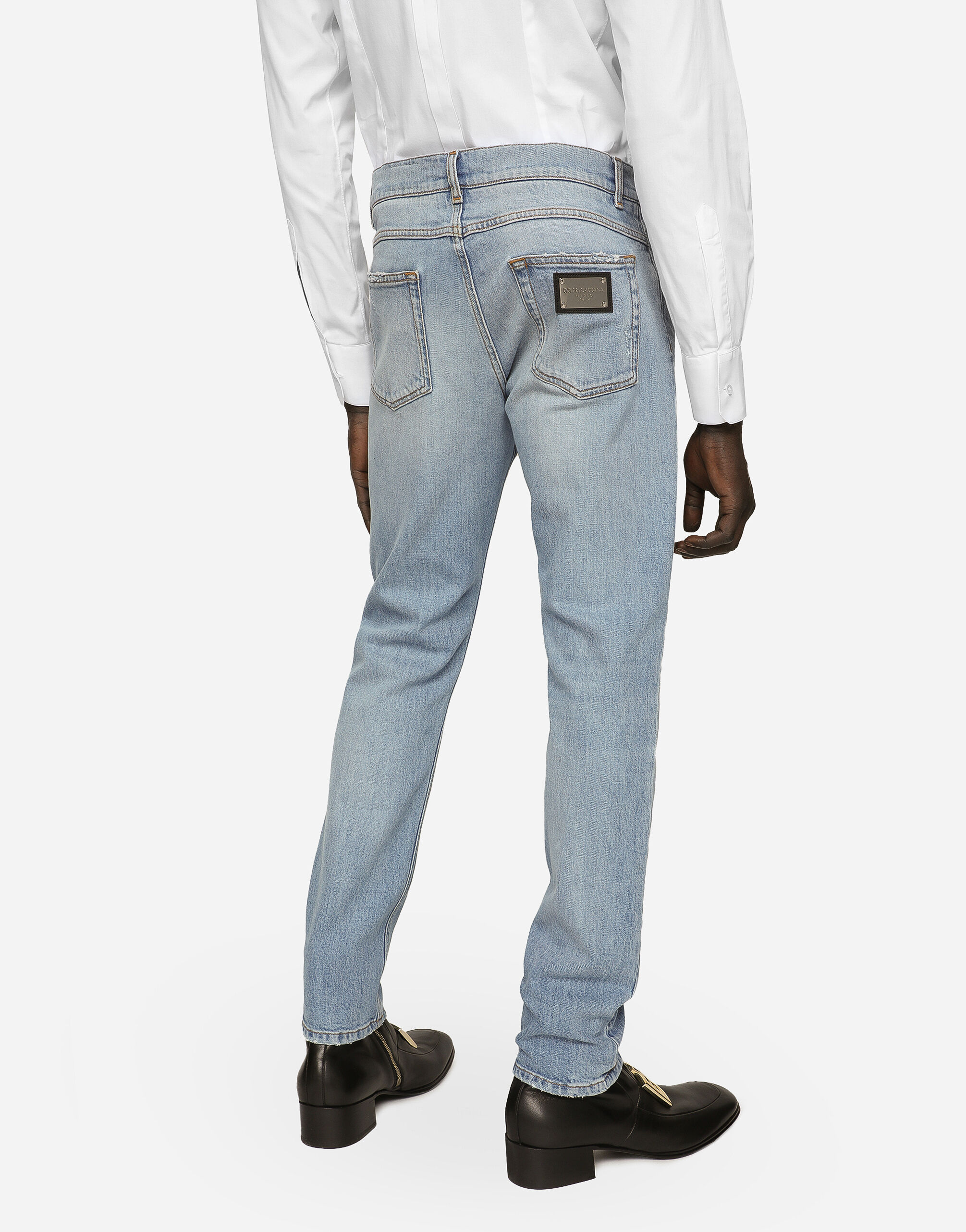 Regular fit washed stretch denim jeans with abrasions