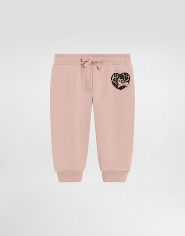 Dolce & Gabbana Fleece trousers with leopard heart patch Pink L2JPI1G7PSG