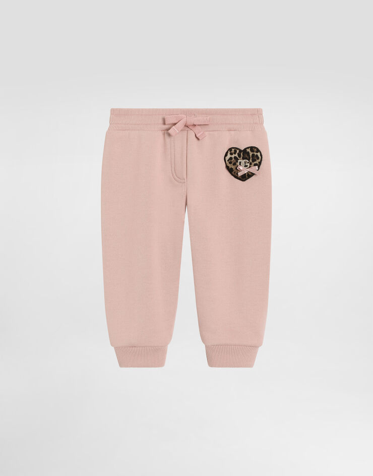 Dolce & Gabbana Fleece trousers with leopard heart patch Pink L2JPI1G7PSG