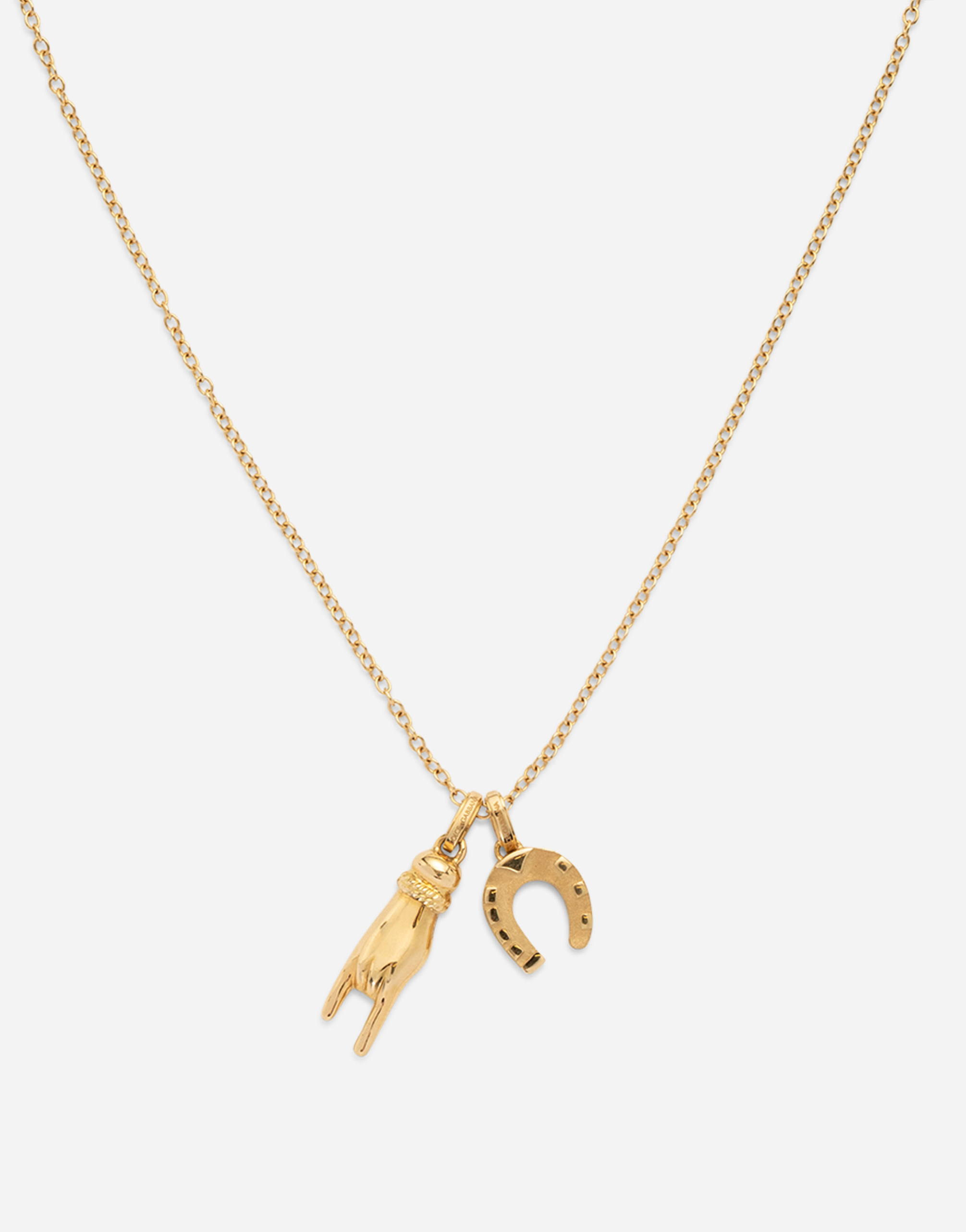 DOLCE & GABBANA GOOD LUCK HAND WITH HORN AND HORSESHOE PENDANTS ON YELLOW GOLD CHAIN
