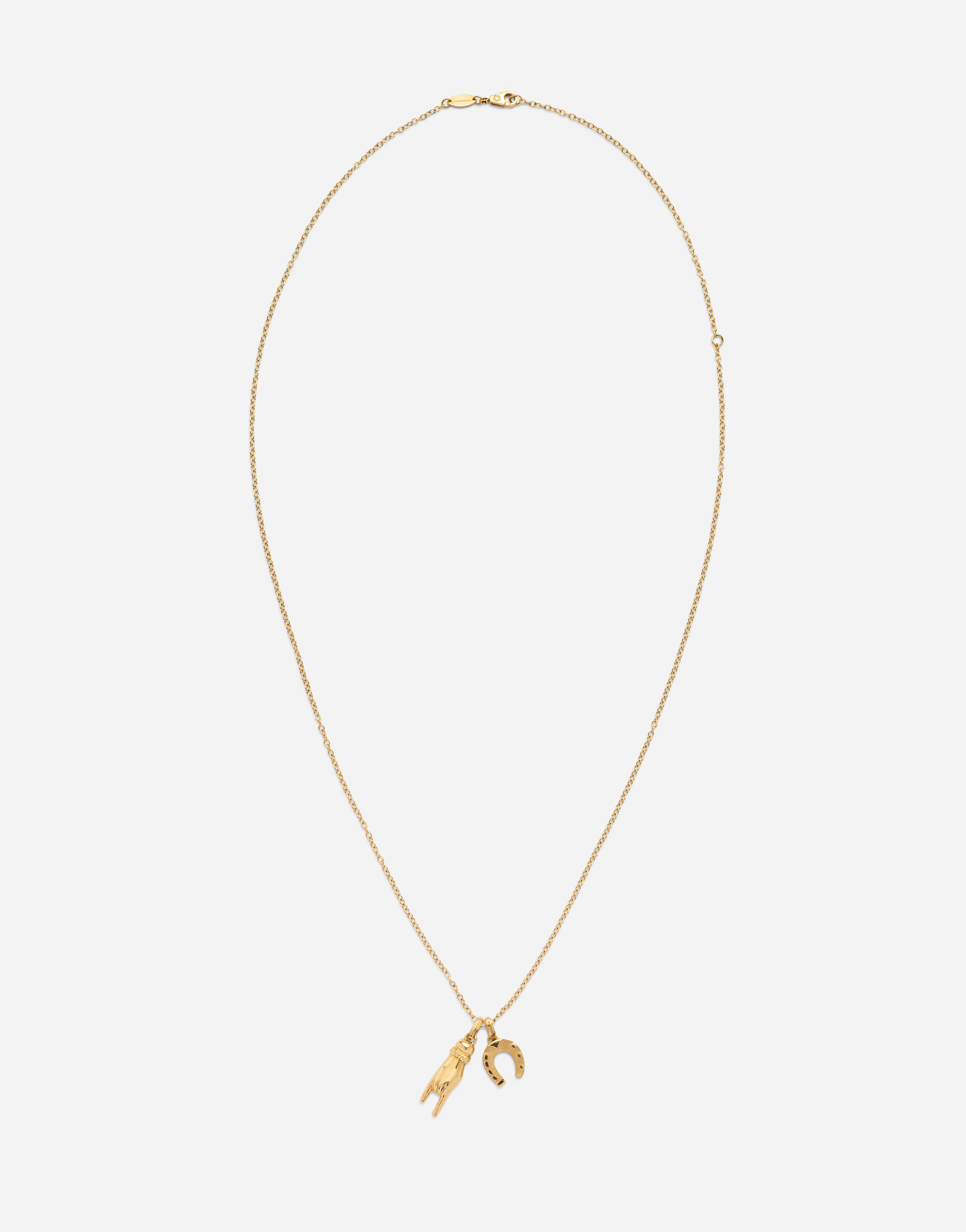 DOLCE & GABBANA GOOD LUCK HAND WITH HORN AND HORSESHOE PENDANTS ON YELLOW GOLD CHAIN