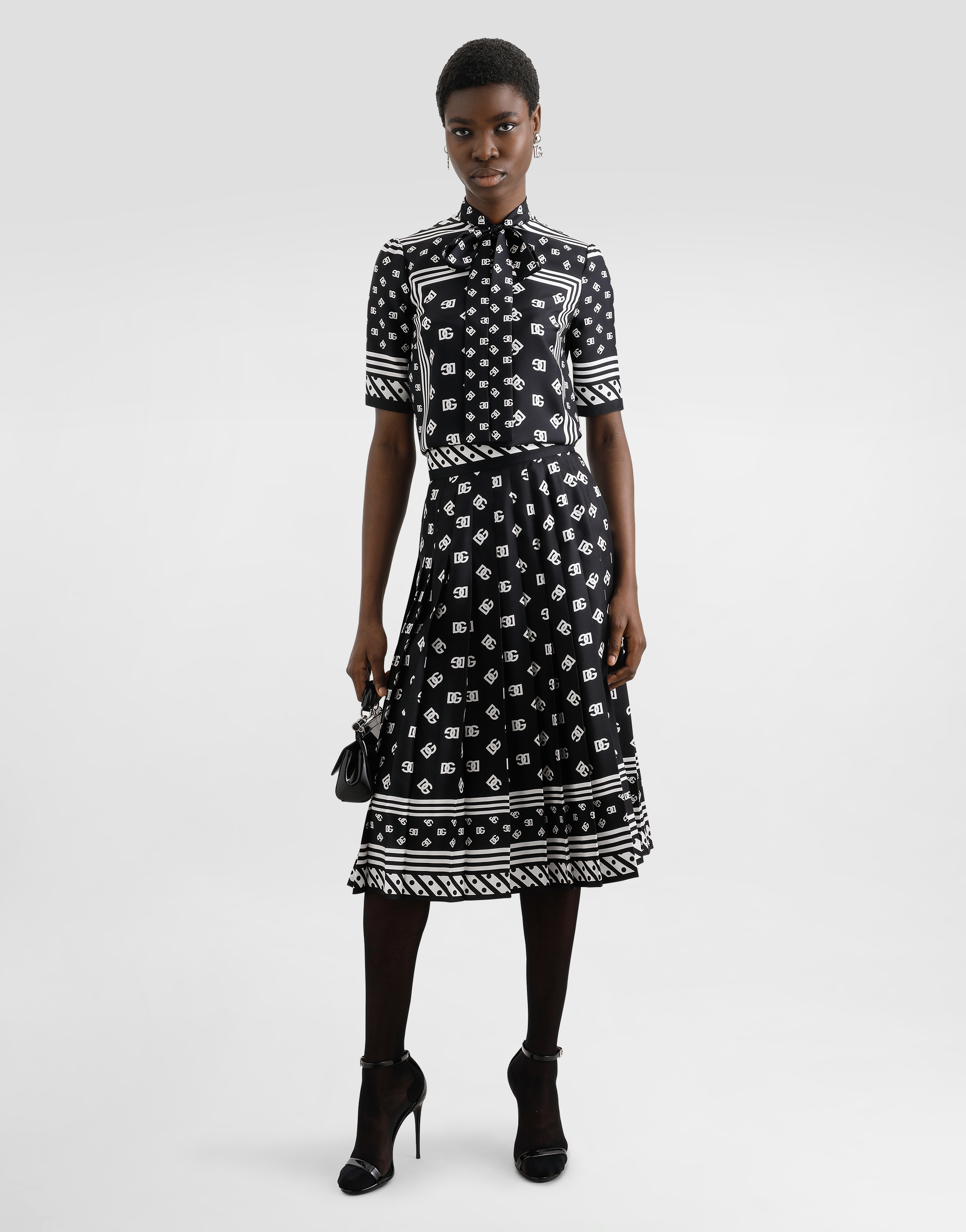 Dolce & Gabbana Skirt With All-over Dg Logo In Black