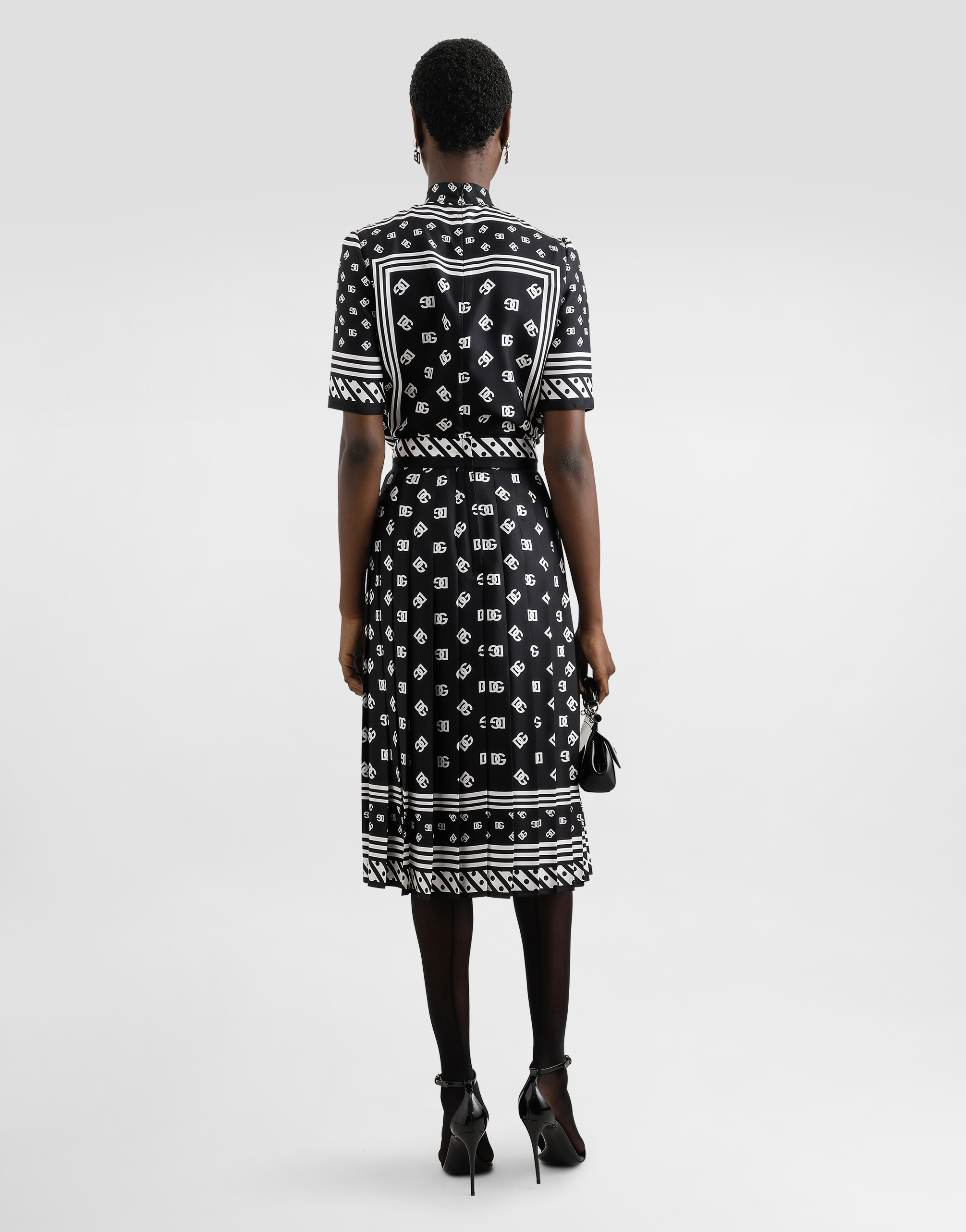 Dolce & Gabbana Skirt With All-over Dg Logo In Black