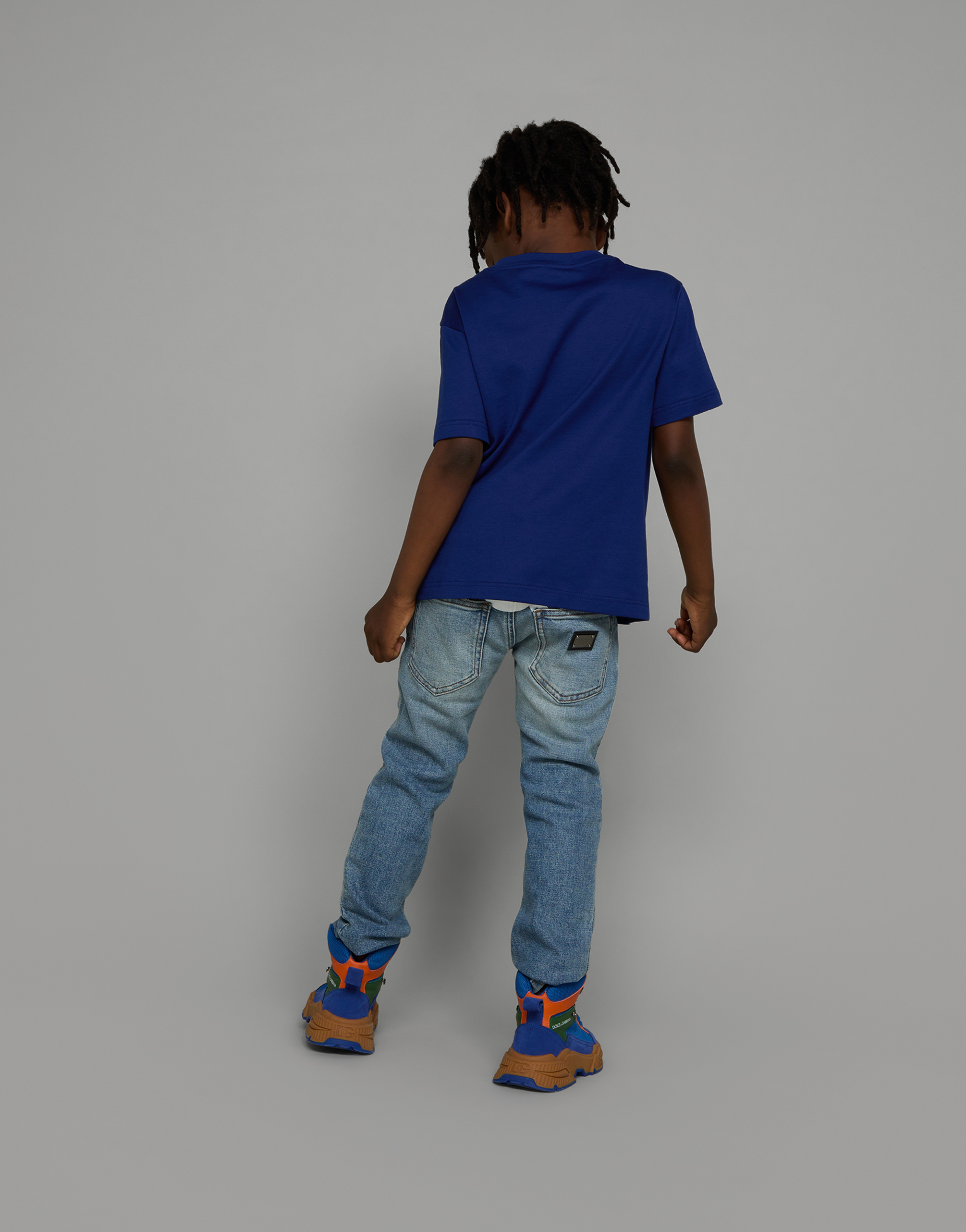 5-pocket treated stretch denim jeans with logo print