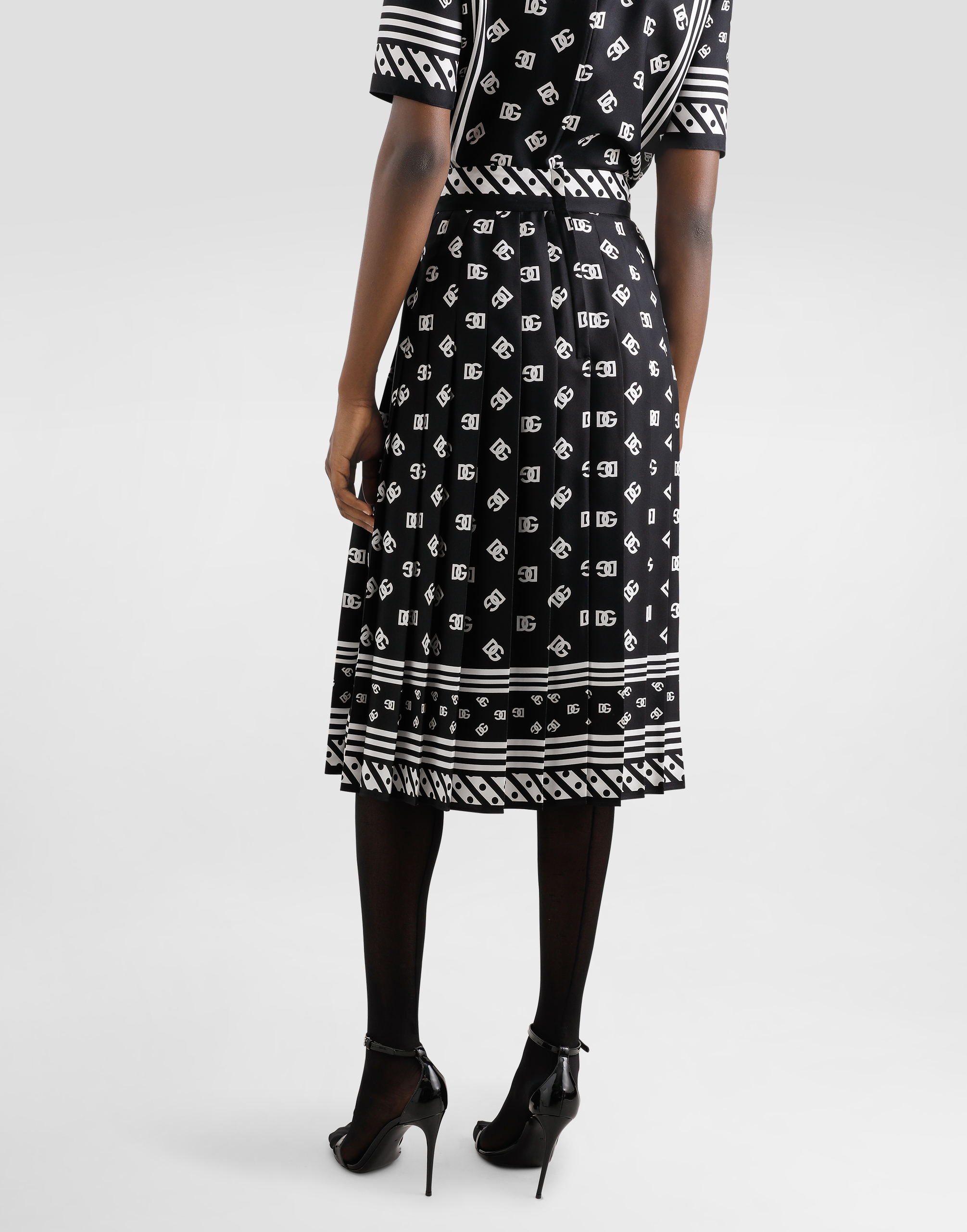 Dolce & Gabbana Skirt With All-over Dg Logo In Black