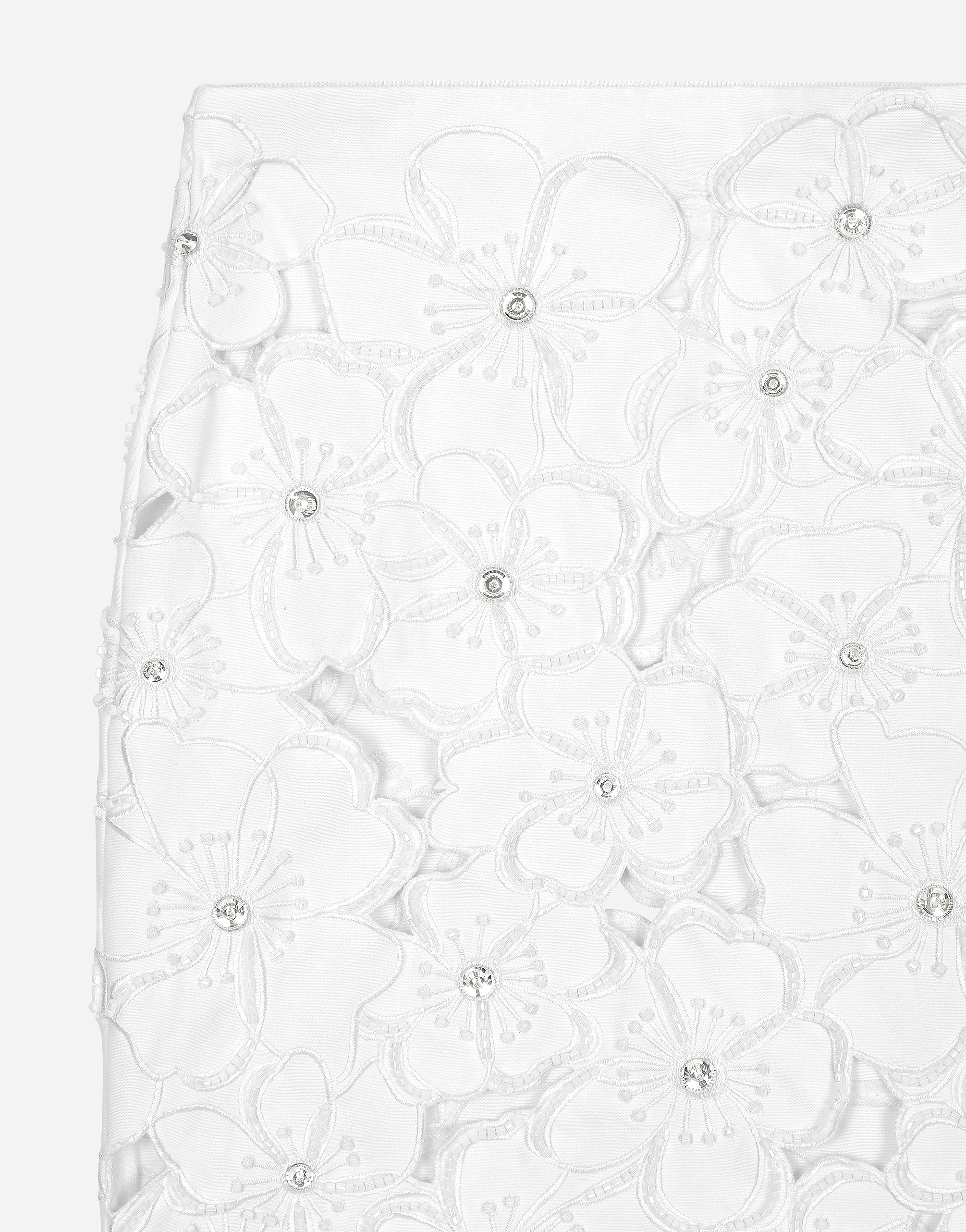 Cotton miniskirt with floral embroidery and rhinestone embellishment