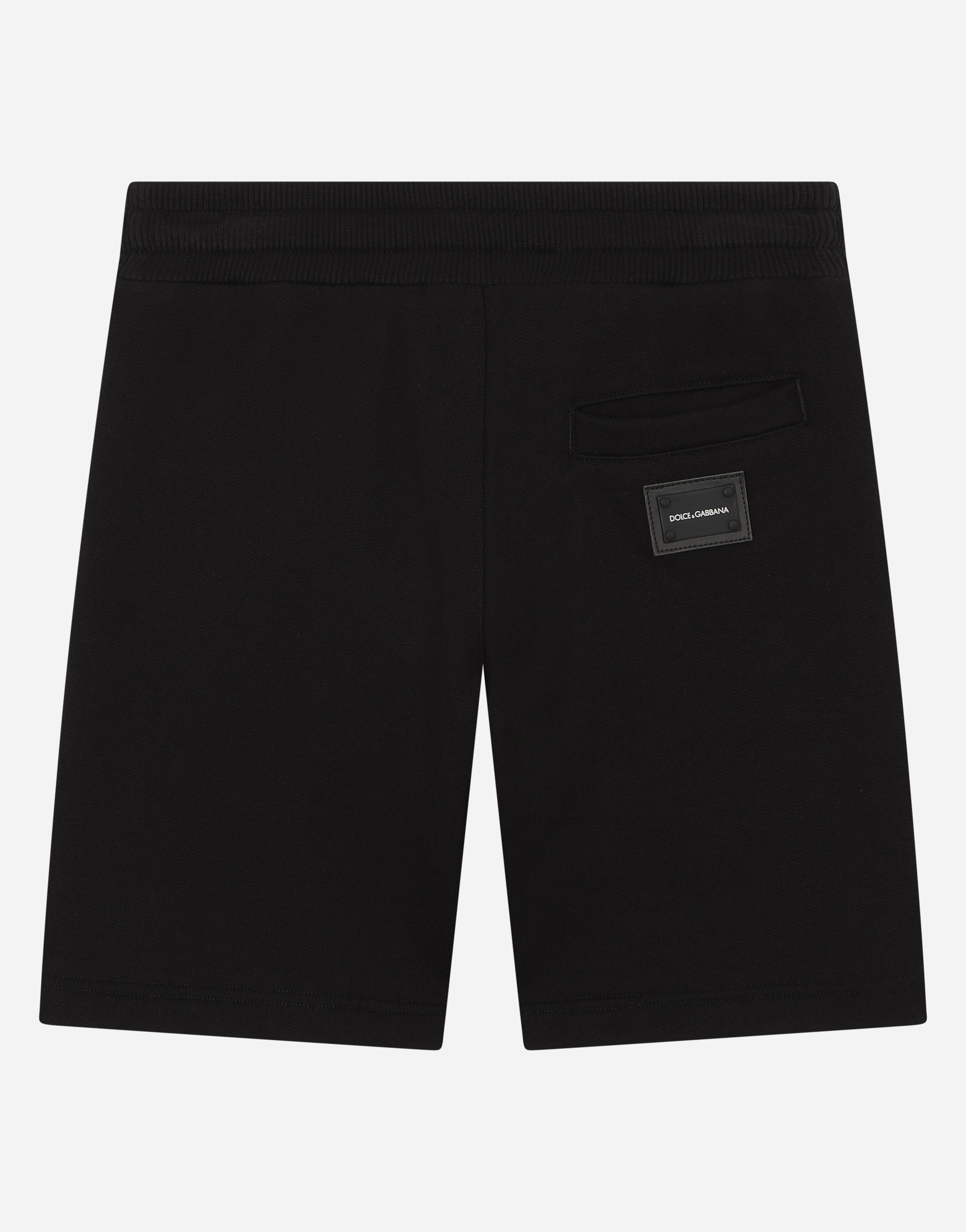 Shop Dolce & Gabbana Jersey Bermuda Jogging Shorts With Logo Plaque In Black