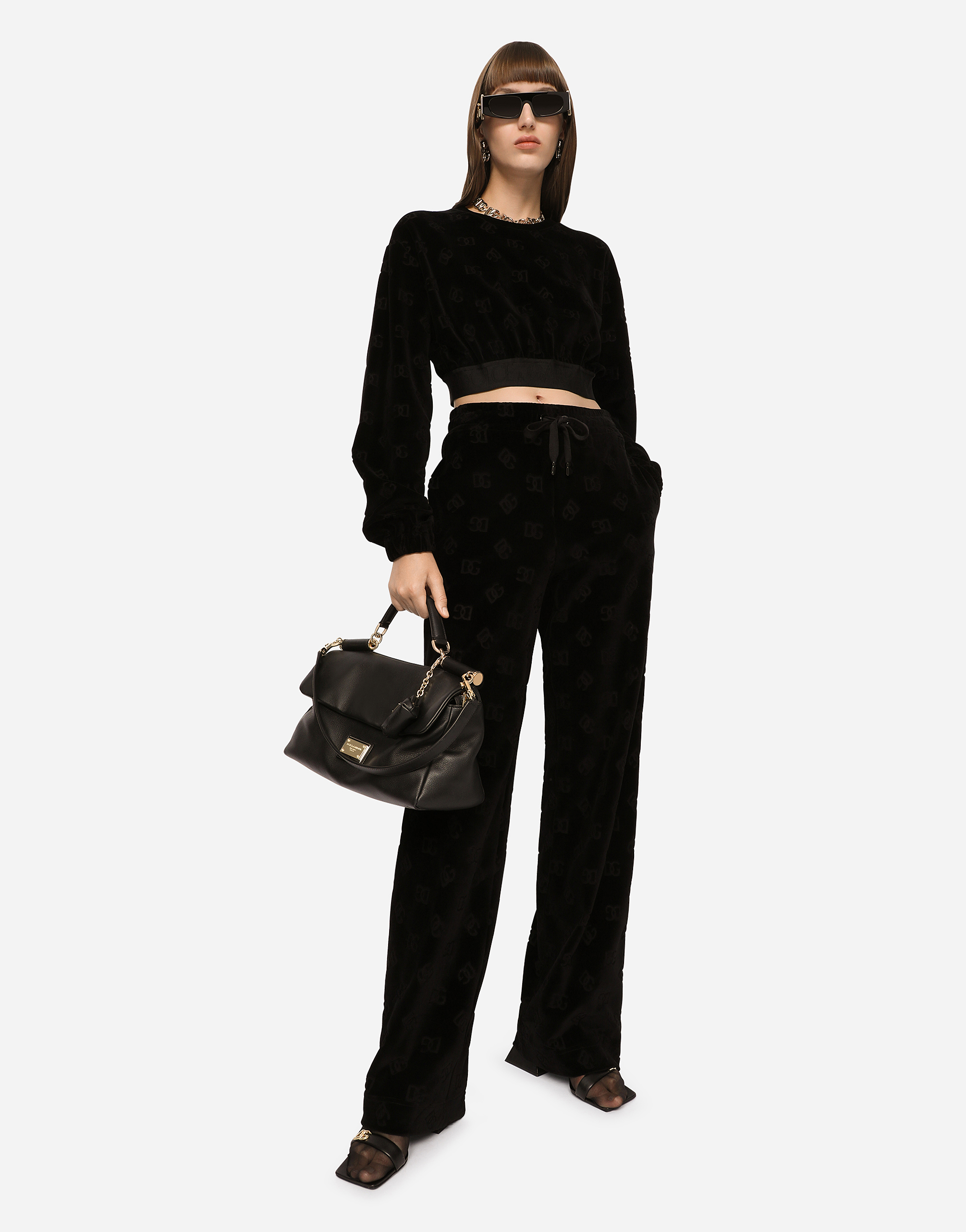 Dolce & Gabbana Flocked Jersey Pants With All-over Dg Logo In Black