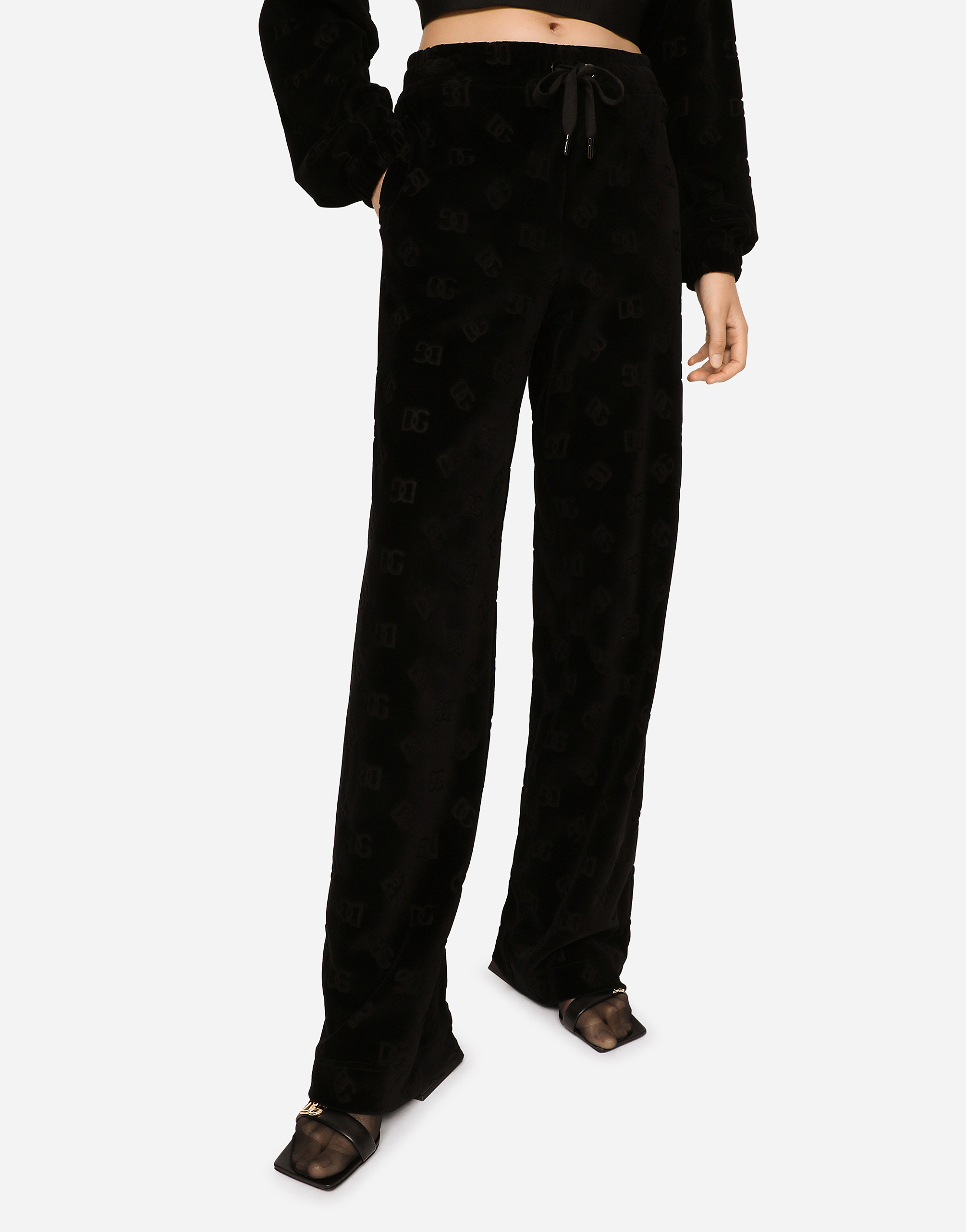 Dolce & Gabbana Flocked Jersey Pants With All-over Dg Logo In Black