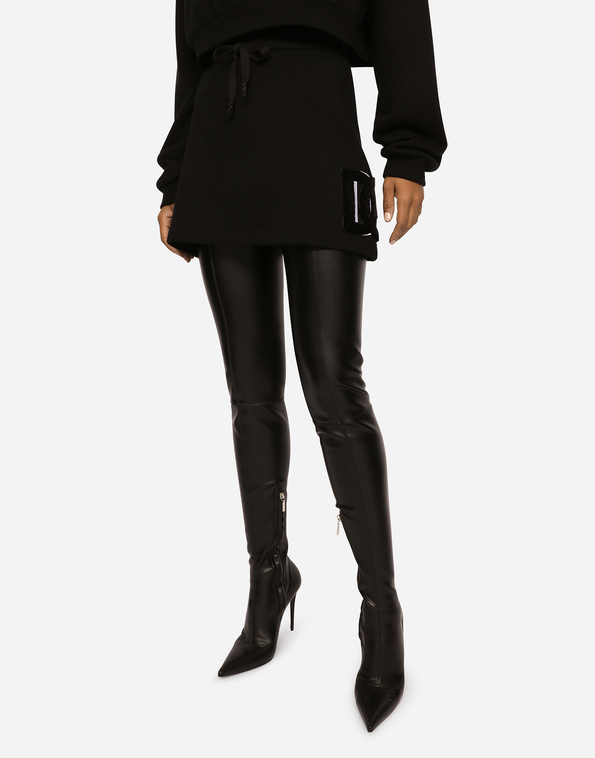 Dolce & Gabbana Jersey Miniskirt With Logo Patch In Black