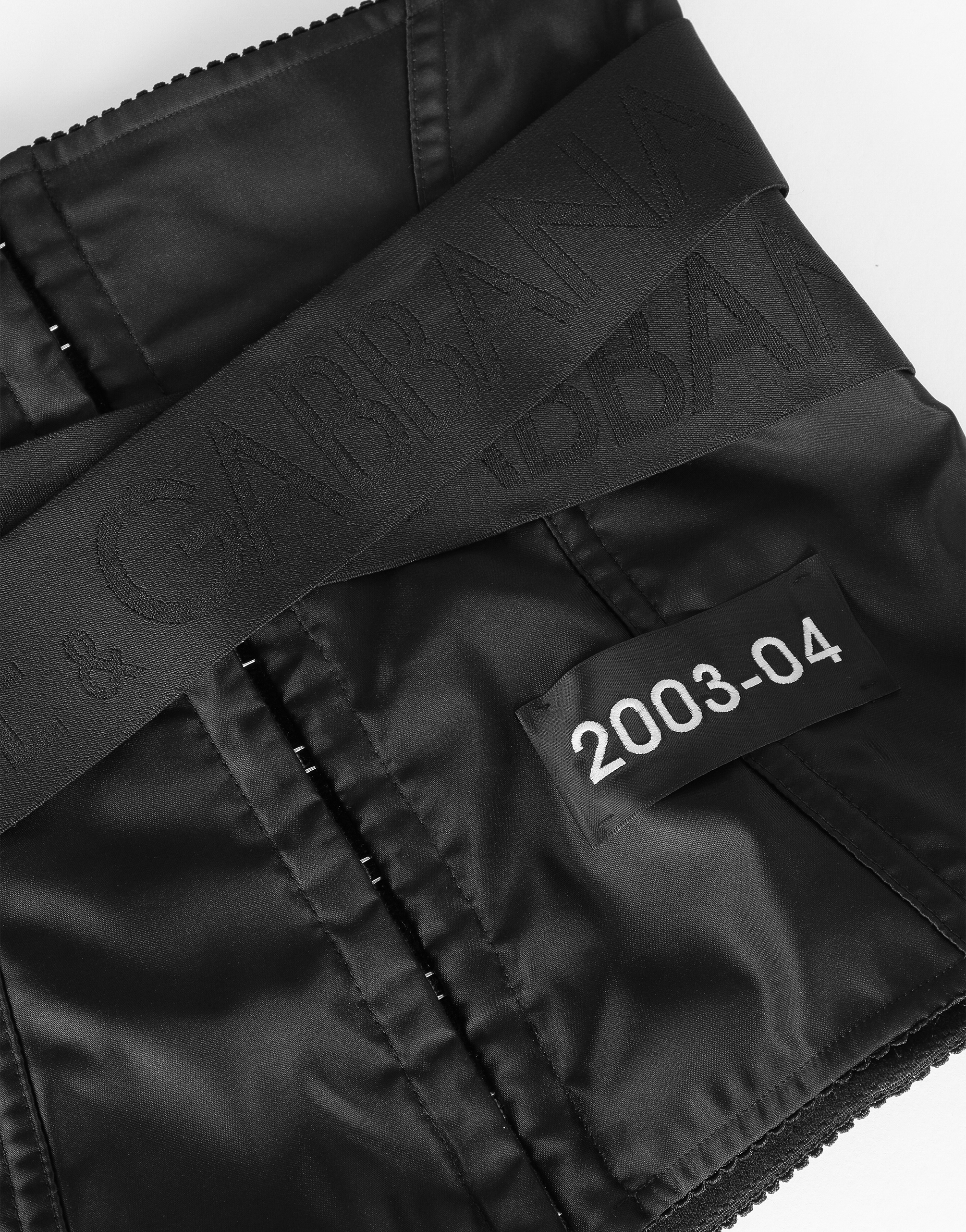 Corset-style belt with branded stretch crossover bands