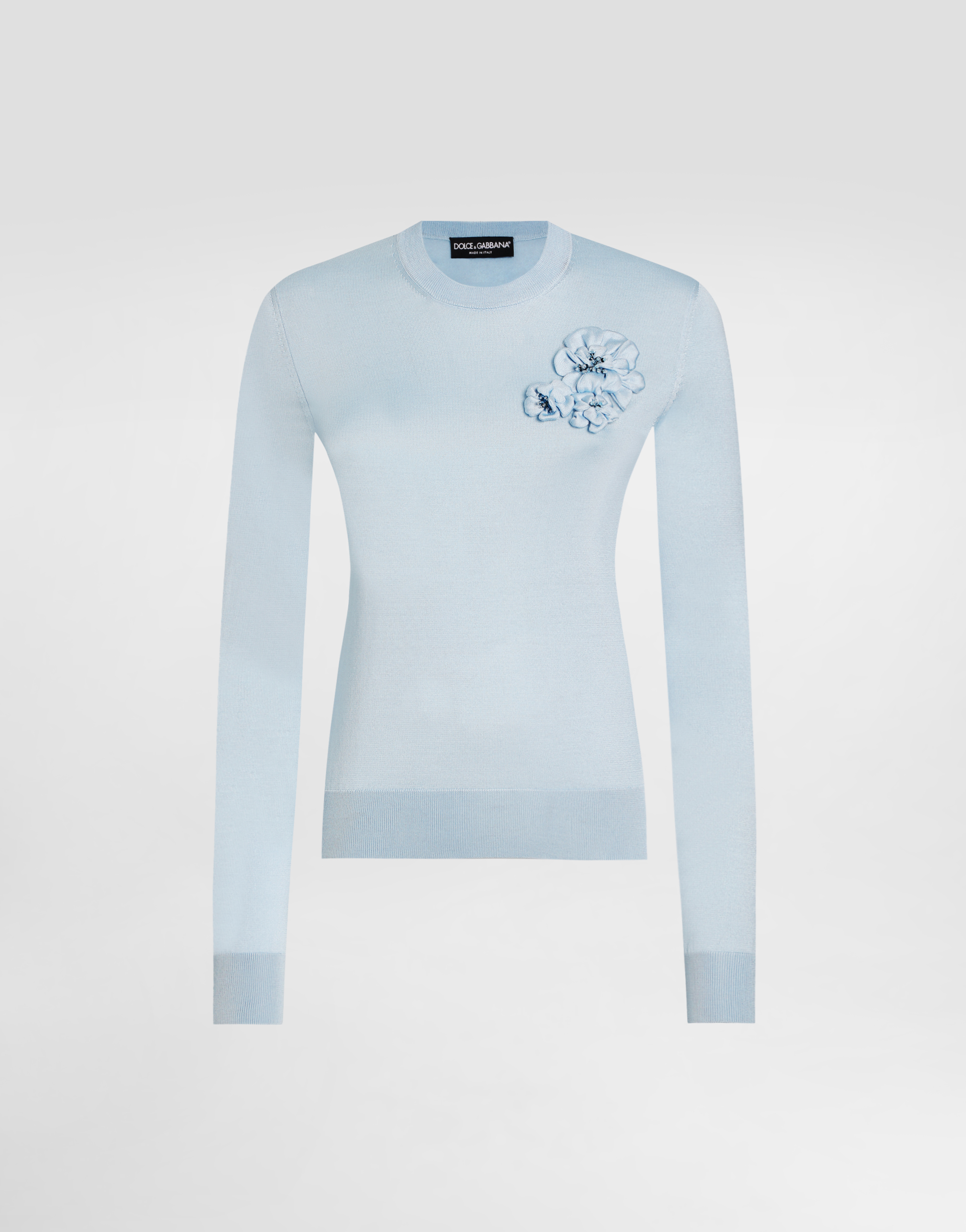 Silk pullover with flower brooch