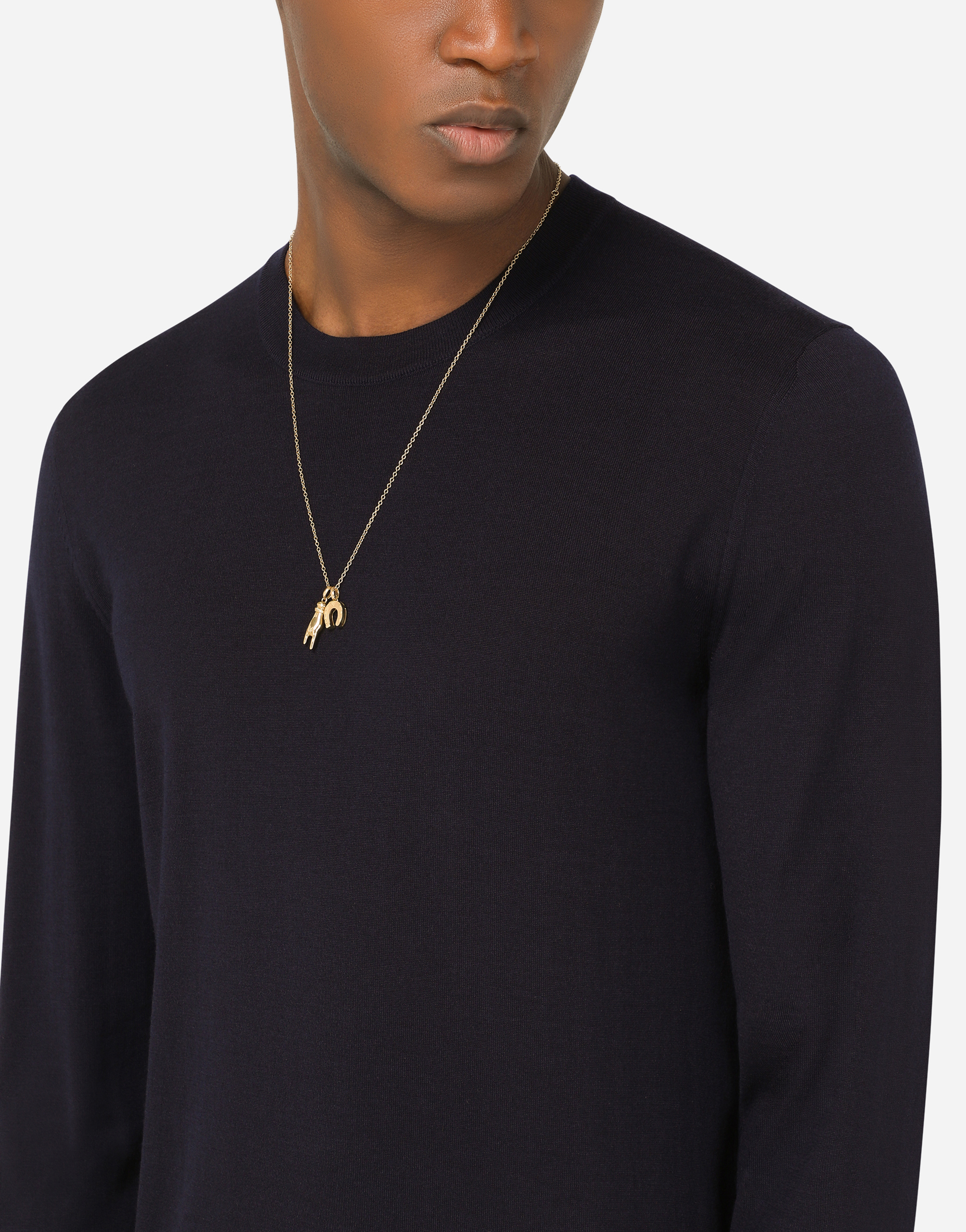 DOLCE & GABBANA GOOD LUCK HAND WITH HORN AND HORSESHOE PENDANTS ON YELLOW GOLD CHAIN