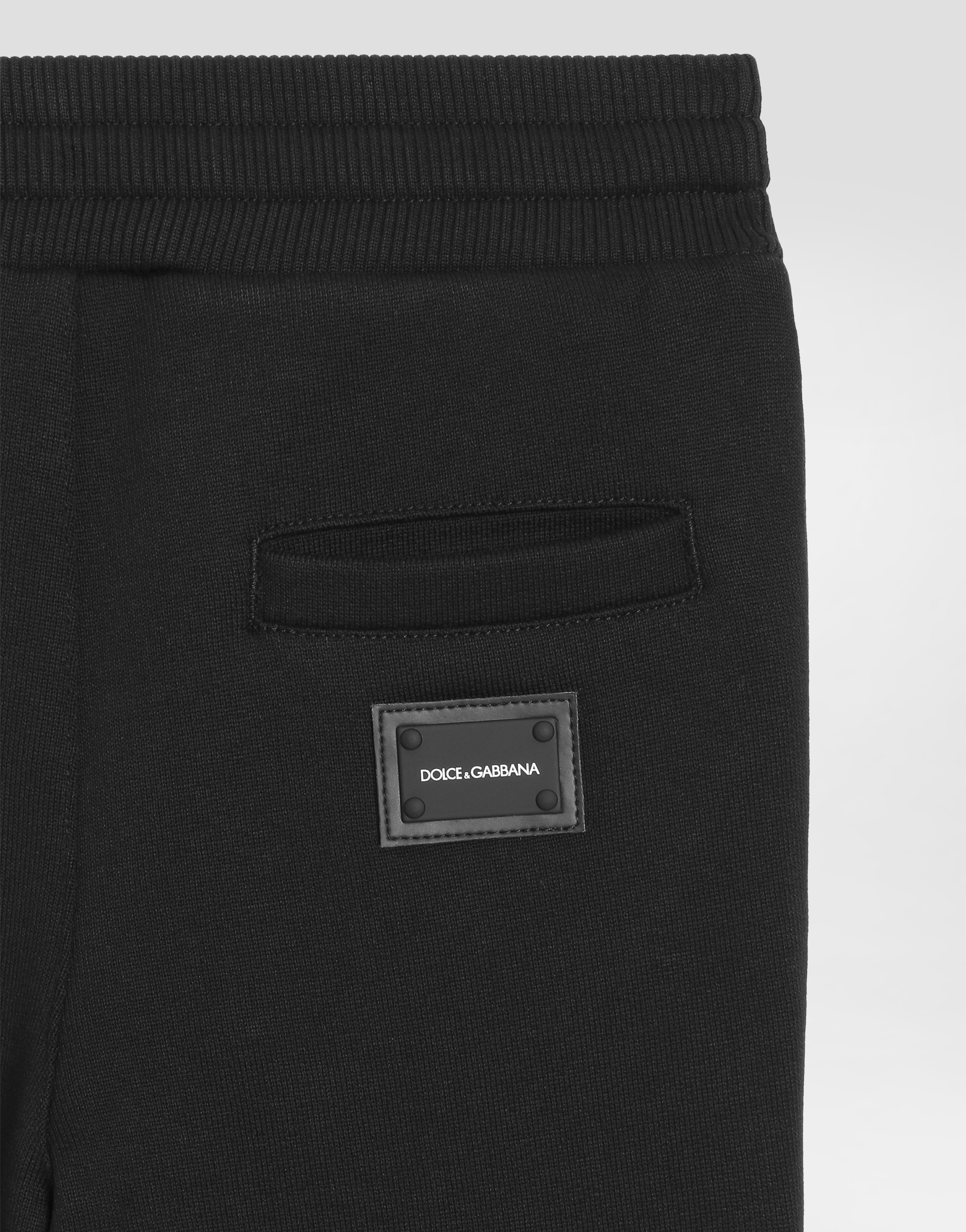 Jersey jogging pants with logo plate